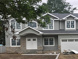 natural stone veneer front bottom porch house steps area bluestone step stoop porch new construction syosset